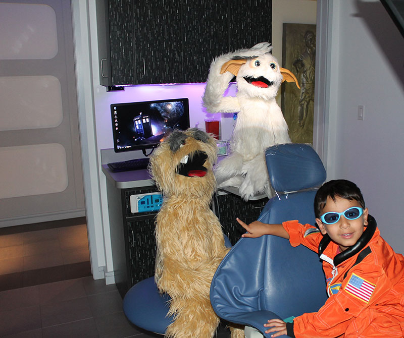 Child with puppets for Pediatric Dentist in Madison, Morristown and Florham Park, NJ